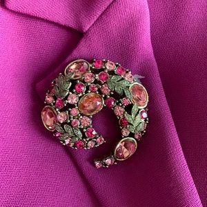 Brooch with brilliant varying shades of pink with silver leaves